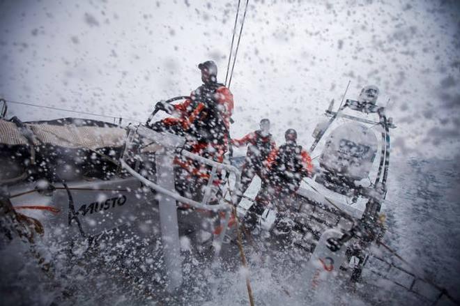 Onboard Team Alvimedica - Dave Swete on the wheel in wet and windy downwind conditions with the rest of his watch partners keeping their weight aft, behind him - Volvo Ocean Race 2015 ©  Amory Ross / Team Alvimedica